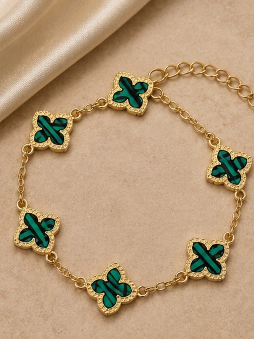 Luxe Gold Bracelet with Emerald Clover Motifs